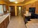 Kitchen boasts wood cabinets, tile counters, and appliances at 6397 Ute Hwy, Longmont, CO 80503