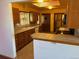 Kitchen features wood cabinets, tile counters, and appliances at 6397 Ute Hwy, Longmont, CO 80503