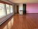 Bright living room with hardwood floors and large windows at 6397 Ute Hwy, Longmont, CO 80503