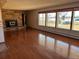 Spacious living room with hardwood floors and fireplace at 6397 Ute Hwy, Longmont, CO 80503