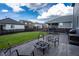Backyard with a stone patio, seating area, privacy fence, and lush lawn perfect for entertaining at 26985 E Bayaud Ave, Aurora, CO 80018