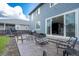 Outdoor patio with seating and a grill, perfect for entertaining and enjoying the backyard at 26985 E Bayaud Ave, Aurora, CO 80018