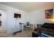Bedroom with a white desk, TV, and play area, offering a functional and fun living space at 26985 E Bayaud Ave, Aurora, CO 80018