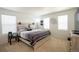 Bright bedroom with light-wood furnishings and decor, and filled with natural light from multiple windows at 26985 E Bayaud Ave, Aurora, CO 80018