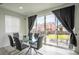 Dining area with a view to the outdoor patio at 26985 E Bayaud Ave, Aurora, CO 80018