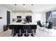 Open kitchen boasts a spacious island with seating and is adjacent to the dining area at 26985 E Bayaud Ave, Aurora, CO 80018