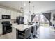 Modern kitchen features a large island with seating and stainless steel appliances at 26985 E Bayaud Ave, Aurora, CO 80018