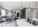 Open-concept living space features modern décor and a stylish staircase at 26985 E Bayaud Ave, Aurora, CO 80018