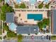 Aerial view of a modern apartment complex with a covered pool and convenient parking at 4100 Albion St # 523, Denver, CO 80216