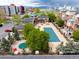 View of a partially covered community pool and attractive landscaping at apartment complex at 4100 Albion St # 523, Denver, CO 80216