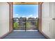 Balcony with a view of neighboring homes, framed by open patio doors at 4100 Albion St # 523, Denver, CO 80216