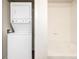 Bathroom space featuring the convenience of a washer/dryer stack, plus a bathtub at 4100 Albion St # 523, Denver, CO 80216
