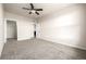 Bright, carpeted bedroom featuring a walk-in closet for storage and a neutral color palette at 4100 Albion St # 523, Denver, CO 80216