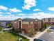 Beautiful three-story apartment building with manicured landscaping and convenient parking at 4100 Albion St # 523, Denver, CO 80216