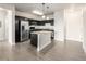 Modern kitchen with stainless steel appliances, granite countertops, and an island at 4100 Albion St # 523, Denver, CO 80216