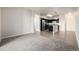 Open floor plan with a living room that flows into a modern kitchen with stainless steel appliances at 4100 Albion St # 523, Denver, CO 80216