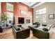 Spacious lounge with comfortable leather seating, a fireplace, and large windows at 4100 Albion St # 523, Denver, CO 80216