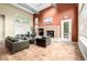 Spacious lounge with comfortable leather seating, a fireplace, and large windows at 4100 Albion St # 523, Denver, CO 80216