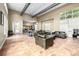 Spacious lounge with comfortable leather seating, a kitchenette, and large windows at 4100 Albion St # 523, Denver, CO 80216