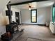 Living room with hardwood floors, wood burning stove, and vintage trim at 219 Colorado Blvd, Idaho Springs, CO 80452