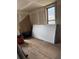 Renovation-ready room with hardwood flooring, ready for your personal design touches and improvements at 219 Colorado Blvd, Idaho Springs, CO 80452