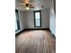 Empty room with hardwood floors, and green trim at 219 Colorado Blvd, Idaho Springs, CO 80452