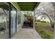 Back patio with a concrete floor and view of the backyard at 4108 S Rifle Way, Aurora, CO 80013