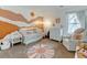 Charming Bedroom with a mountain mural, plush chair, and cute decor accents at 4108 S Rifle Way, Aurora, CO 80013