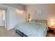 Bright bedroom featuring vaulted ceilings, neutral walls, and a comfortable-looking bed at 4108 S Rifle Way, Aurora, CO 80013
