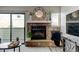 Elegant stone fireplace with decorative mantel and hearth at 4108 S Rifle Way, Aurora, CO 80013