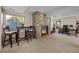 Finished basement with stone fireplace and sitting area at 1271 Berganot Trl, Castle Pines, CO 80108