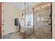Luxurious bathroom featuring a soaking tub, glass shower, and stylish tile work at 1271 Berganot Trl, Castle Pines, CO 80108