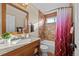 Traditional bathroom with granite vanity and tiled shower at 1271 Berganot Trl, Castle Pines, CO 80108