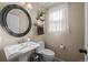Bathroom with pedestal sink, and neutral walls at 1271 Berganot Trl, Castle Pines, CO 80108