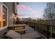 Large, private deck with outdoor seating, cooking area, and open sky view at 1271 Berganot Trl, Castle Pines, CO 80108