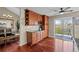 Dining area with hardwood floors, stylish lighting, and sliding glass doors leading to a deck at 1271 Berganot Trl, Castle Pines, CO 80108