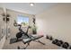 Home gym area with workout machines and weights at 1271 Berganot Trl, Castle Pines, CO 80108