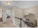 Upstairs hallway with black and white railing, neutral carpet, and a chandelier at 1271 Berganot Trl, Castle Pines, CO 80108