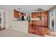 Spacious kitchen with cherry cabinets, sleek stainless steel appliances, and elegant granite countertops at 1271 Berganot Trl, Castle Pines, CO 80108