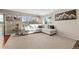 Cozy living room with a comfortable sectional sofa and plenty of natural light at 1271 Berganot Trl, Castle Pines, CO 80108