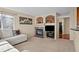 Inviting living room with a cozy fireplace, comfortable seating, and stylish decorative elements at 1271 Berganot Trl, Castle Pines, CO 80108