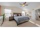 Spacious main bedroom with neutral walls, vaulted ceilings, and a large picture window at 1271 Berganot Trl, Castle Pines, CO 80108