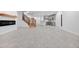 Open concept basement with kitchen, fireplace and stairs at 30410 E 161St Ave, Brighton, CO 80603