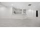 Basement kitchen with white cabinets and an island at 30410 E 161St Ave, Brighton, CO 80603
