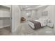 Well-lit bedroom with a queen bed, walk-in closet and light decor at 30410 E 161St Ave, Brighton, CO 80603