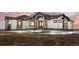 Stunning two-story home with a stone and white exterior at 30410 E 161St Ave, Brighton, CO 80603