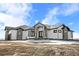 Luxury ranch home with a grand entrance and stone accents at 30410 E 161St Ave, Brighton, CO 80603