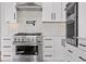 Stylish kitchen with white cabinets, stainless steel appliances, and backsplash at 30410 E 161St Ave, Brighton, CO 80603