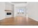 Living room with hardwood floors and fireplace at 30410 E 161St Ave, Brighton, CO 80603
