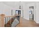 Elegant staircase with wood railing and a chandelier at 30410 E 161St Ave, Brighton, CO 80603
